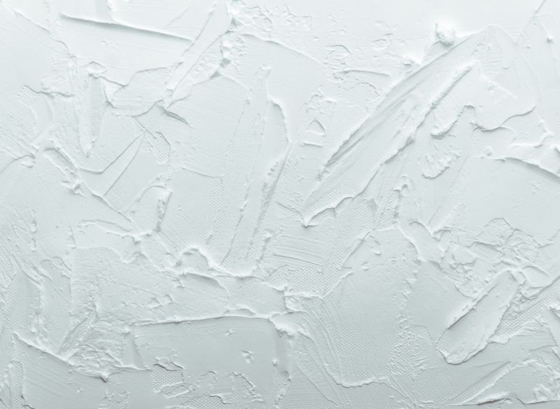 A white wall texture laid on with a trowel, seen close — {{SERVICE_4}}
